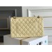 Chanel Classic Flap bag Medium 25 Light Yellow with champagne gold hardware, Caviar leather, Hass Factory leather, seamless.